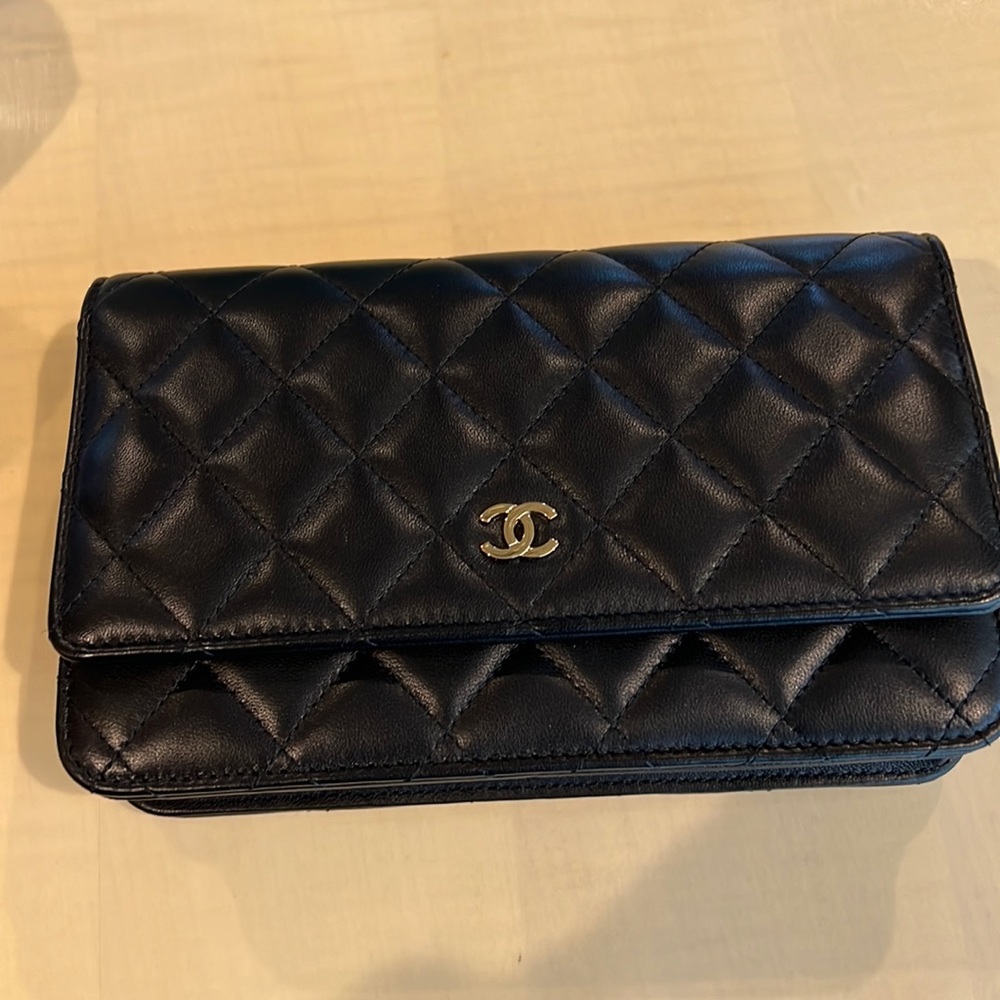 Chanel black lamb’s skin wallet on chain.